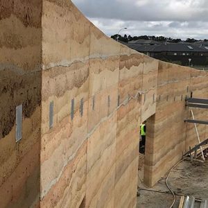 Livingston Childcare Centre rammed earth walls by Olnee